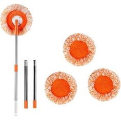 three orange and white cleaning brushes on top of each other next to a plunger