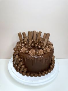 a cake with chocolate icing and candies on top