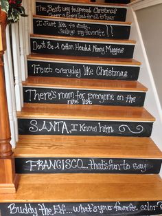 a set of stairs with chalk writing on the bottom and handwritten christmas messages on each step