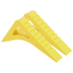 two yellow pieces of plastic on a white background