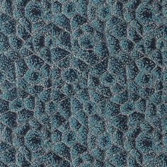 an up close shot of the texture of a blue fabric