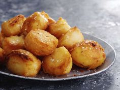 a plate full of fried potatoes on a table