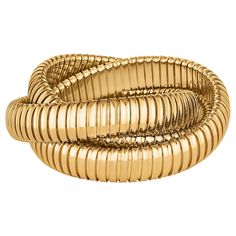 With a timeless but modern style, this chic intertwined three strand 12mm tubogas rolling bangle bracelet was originally inspired by the flexible automotive gas tubing of the 1920’s. Translated into luxurious 18 karat yellow gold and easily stacked with other pieces, this everyday bangle is now an iconic wardrobe accessory. Also available in all 18 karat tri-color gold or sterling silver. Available in small, medium, and large sizes. Crafted in Italy. Fox Jewelry, Modern Bracelets, Yellow Gold Bangle, Antique Bracelets, Color Jewelry, 18k Gold Jewelry, Hinged Bracelet, Bangle Designs, Gold Bangle Bracelet