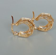 IMPORTANT **Please go through all the pictures i have posted for a listing with a ruler, on a model, on my hand, to get an exact idea of the actual size of the item.A PAIR of filigree sterling silver ear hoops. These hoops are dipped in gold. Size: 16 x 14 x4 mm Weight: 2.95 gm Price listed is for ONE PAIR These are made of 925 hypoallergenic sterling silver. Most of my pieces come with a 925 stamp. Can be packaged in a gift box. I can include a personal message from you if needed You are welcom Rose Gold Metal Hoop Earrings For Anniversary, Small Hoop Earrings With Lever Back As Gift, Gold Nickel-free Huggie Earrings For Formal Events, Gold Nickel-free Huggie Earrings For Formal Occasions, Gift Small Hoop Earrings With Lever-back Ear Wires, Formal Gold Nickel-free Huggie Earrings, Gold-plated Huggie Earrings With Lever Back, Gold Plated Gold Huggie Earrings With Lever Back, Gold Hypoallergenic Hoop Earrings For Formal Occasions