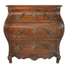 an old wooden dresser with ornate carvings on the top and bottom drawer, isolated against a white background