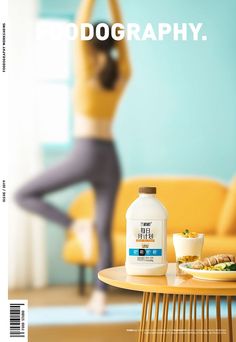 a woman is doing yoga in front of a table with food and drink on it