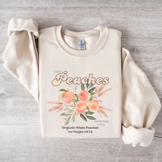 Peach Sweater, Fruit Sweatshirt, Fruit Lover, Peaches Shirt, Fruits, Peaches Sweater, Peach Graphic Sweater, Gift For Women, Fruits Sweater SIZING - For oversized look, size up 1-2! WHEN CAN I EXPECT MY ORDER - Processing Time: 1-3 days - During holidays please expect delays as the number of orders are slightly higher than usual, although we will do our best to get your order to you as soon as possible. SHIPPING TIME - Shipping times average between 2-5 days. CARE INSTRUCTIONS - Wash inside out Peach Long Sleeve Cotton Top, Long Sleeve Peach Cotton Top, Fruit Sweatshirt, Peach Sweater, Peach Graphic, Peach Shirt, Graphic Sweaters, Sweater Gift, Gift For Women