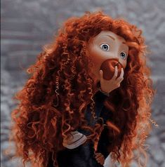 a doll with red hair holding an apple up to her face and looking at the camera