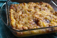 a casserole dish filled with some type of food on a blue table cloth