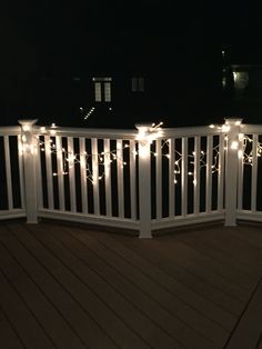 a deck with lights on it at night