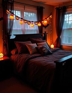 a bedroom decorated for halloween with pumpkins on the bed and lights hanging from the windows