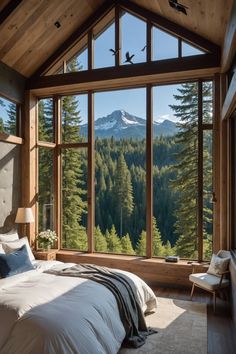 a bedroom with a large window overlooking the mountains