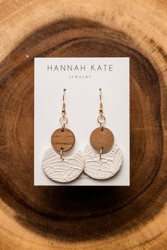 the earrings are made from wood and have two circles on each earring, one with a