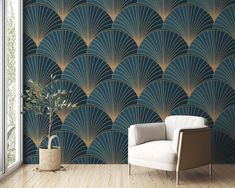 an art deco wallpaper design in blue and gold with a white chair next to it