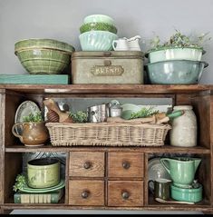 an old wooden cabinet filled with dishes and pots