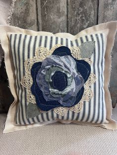 a decorative pillow with a flower on it