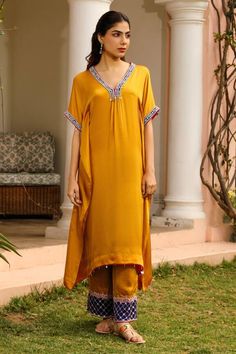 Mustard yellow kaftan featuring zardozi, resham and bead embroidered neck and sleeve hem. Pair with a straight pant and an inner. - Aza Fashions Yellow Bohemian Saree Set, Bohemian Yellow Saree Set, Yellow Bohemian Straight Kurta Set, Traditional Yellow Maxi Length Sets, Bohemian Yellow Sets With Resham Embroidery, Bohemian Yellow Kurta With Zari Work, Yellow Embroidered Salwar Kameez For Eid, Elegant Yellow Kurta With Mirror Work, Eid Palazzo Set With Dabka Work And V-neck