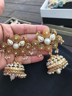 You are looking at a pair of beautiful hand crafted White Pearl and gold chandelier earrings. It took us 4 months to create the look and translate it into this design. ** A one of a kind piece inspired by the Royals fused with the Victorian styling. ** A very rare find ** 22 K Gold plated . ** Traditional Indian Jewelry. **Length- 3.8 inches ** Exquisite Filigree work has been done which makes it very exquisite These earrings will be shipped with delivery confirmation They come in a individual g Luxury Meenakari Pearl Earrings For Wedding, Luxury Fusion Chandelier Earrings With Latkans, Luxury Gold Chandelier Earrings With Meenakari, Wedding Gift Set, Gold Chandelier Earrings, Silver Bracelets For Women, Gold Bridal Earrings, Mens Bracelet Silver, Beaded Cuff Bracelet