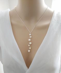 This is an original design by © Isabella Bridal. Description:  * Swarovski  pearl *The Drop chain length is4 inches * Style: Minimalist Feel free to contact me with any questions! Custom orders are welcome. All orders will ship within 48 hours, except for weekends ALL ORDERS ARE SHIPPED VIA USPS FIRST CLASS WITH TRACKING. Handmade in the USA This item is Made-to-Order and therefore is a final sale. Drop Pearl Necklace, Wedding Jewelry Necklace, Dainty Wedding, Pearl Drop Necklace, Pearl Necklace Wedding, Necklace Wedding, Wedding Jewellery Necklace, Necklace Dainty, Swarovski Pearls