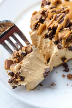 a piece of ice cream pie with chocolate chips on top and a fork in it