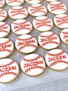 cookies decorated with red and white baseball stitches