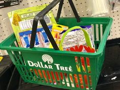 a dollar tree shopping basket filled with items on the shelf in a store or department