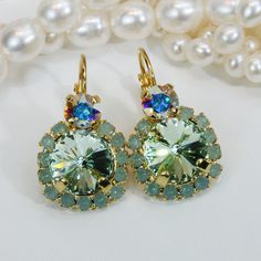 "Mint Drop Earrings Mint premium Crystal Gold Earrings Mint Ab Drop Earring Mint Wedding Mint Gold Set Pacific Opal Halo earring,Gold,GE102 A sparkly pair of Drop Earrings made with two genuine 7mm (29SS) and 10mm (48SS) premium high quality crystals. The large stone is Surrounded by small sparkling crystals. Total diameter of the large stone and strass 5/8\" (16mm) The length of stone area 3/4\" (19mm) Total Length of earring 1\" (25mm) Will add just the right hint of color. Ring: A sparkly com Green Cluster Earrings For Wedding, Handmade Green Crystal Earrings For Wedding, Handmade Green Crystal Wedding Earrings, Green Crystal Wedding Earrings With Ear Wire, Round Lever Back Wedding Earrings, Round Wedding Earrings With Lever Back, Green Clip-on Wedding Earrings, Green Round Crystal Earrings For Wedding, Green Crystal Earrings For Wedding