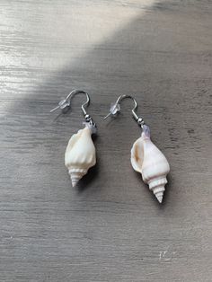 Dangle seashell earrings with backs Shell Earrings For Beach With Pierced Ears, White Dangle Shell Earrings, Beachy Shell Dangle Earrings, Silver Shell Dangle Earrings, Shell-shaped Earrings With Ear Wire, Shell-shaped Shell Earrings With Ear Wire, Ocean-inspired Shell Shaped Jewelry With Matching Earrings, Ocean-inspired Dangle Shell Earrings, Seashell Earrings