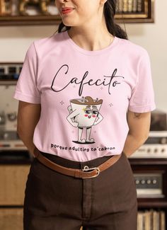 Cafecito porque adulting ta'cabron shirt, Latina shirt, Latina gift, Spanish shirt, Spanish gift, Regalos en español, Funny Spanish, Spanish The unisex soft-style t-shirt puts a new spin on casual comfort. Made from very soft materials, this tee is 100% cotton for solid colors. Heather colors and sports grey include polyester. The shoulders have twill tape for improved durability. There are no side seams. The collar is made with ribbed knitting to prevent curling damage.  .: Made with 100% ring- Casual Tops With Funny Text For Gifts, Casual Shirt With Funny Text As Gift, Coffee-colored Cotton Top For Gift, Coffee Color Cotton Top As Gift, Coffee Cotton Top For Casual Wear, Funny Spanish, Spanish Shirts, Spanish Humor, Raleigh Nc