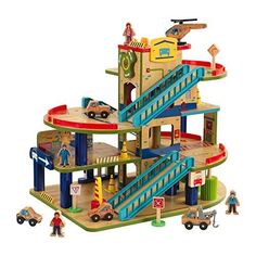 a toy set with cars and people on the top floor, including a staircase leading up to a second story