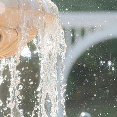 a close up of water coming out of a faucet