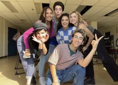 a group of young people posing for a photo