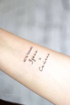 a woman's arm with writing on it that says, love and joy in cursive font