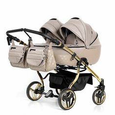 two baby strollers sitting next to each other in front of a white background with gold trim