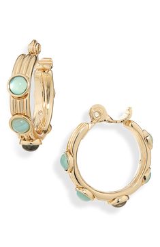 Perfect for daily wear, these clip-on huggie hoop earrings showcase polished cabochons for sophisticated style. Clip-on style Goldtone plate/faux stone Imported Earrings In Gold, Faux Stone, Huggie Hoop Earrings, Sophisticated Style, Anne Klein, Nordstrom Rack, Daily Wear, Gold Tones, Jewelry Earrings