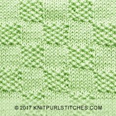 a close up view of the texture of a green knitted fabric with small squares