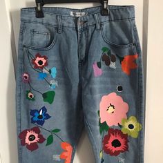 Urban Outfitters Vintage Pants. Very Unique Painted Flower Design. Brand New Without Tags. Not From Urban Outfitters Just For Exposure!! Actually From Misslook. Size Medium!! Blue Denim Pants With Floral Print, Blue Denim Floral Print Pants, Blue Floral Print Denim Pants, Casual Floral Embroidered Pants For Spring, Blue Floral Print Wide Leg Jeans, Multicolor Floral Print Pants For Spring, Spring Multicolor Floral Print Pants, Summer Floral Print Denim Pants, Trendy Denim Pants With Floral Print