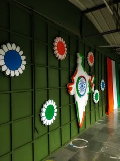 the wall is decorated with many colorful flowers