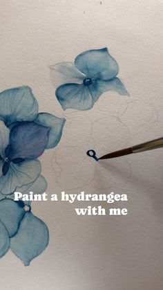 someone is painting flowers with watercolors on the paper that says paint a hydrangea with me