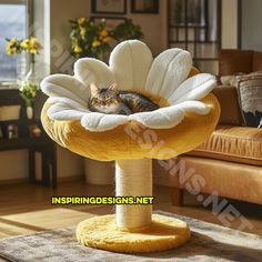 a cat laying on top of a yellow flower shaped scratching post in a living room