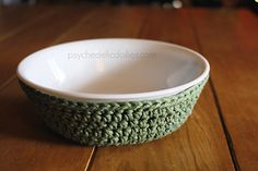 a white bowl sitting on top of a wooden table