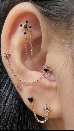 a woman with three different piercings on her ear