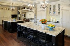 an image of a kitchen with white cabinets and granite counter tops on the website page