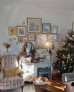 a living room filled with furniture and a christmas tree in the corner next to it