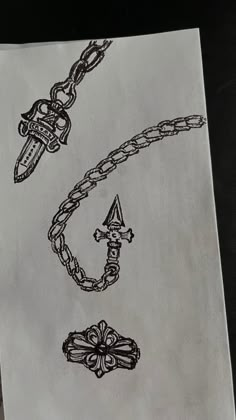 a piece of paper that has some type of chain on it, and an object in the middle