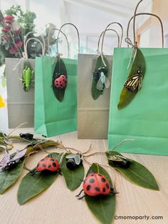 four bags with ladybugs on them sitting on a table