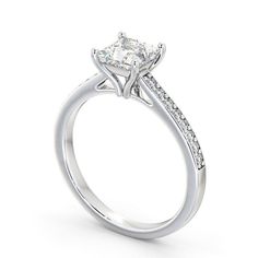 a white gold engagement ring with a princess cut center stone and pave set shoulders