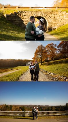 two people standing in front of a stone bridge and one person holding a baby while the other