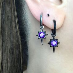 Our Classic North Star earrings are now available as a hoop.   Earrings are made of 316 Stainless steel, and set with Blackened Purple  CZ. Hoops are perfect for both men and women. Total height: 30 mm Hoop Inner diameter: 10.5 mm Post Gauge: 22G (regular piercing) *RETURNS / REFUNDS * -If you would like to return you purchase , please contact us within 7 days of receiving your package and we will accept the return.Return will only be made to the product, and not the shipping cost.  -Buyer is  r