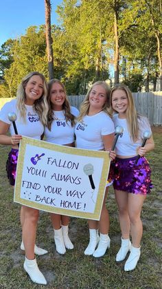 four girls are holding a sign that says falion you'll always find your way back home